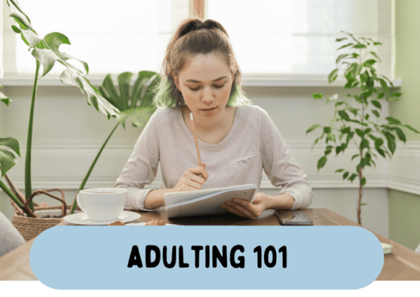 A woman seated at a table with the text "Adult 101" showcasing her Clubhouse Membership.