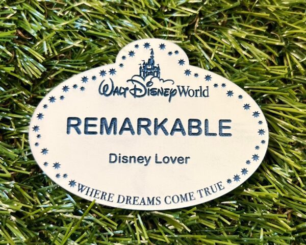 A Disney Cast Member Badge sticker.
