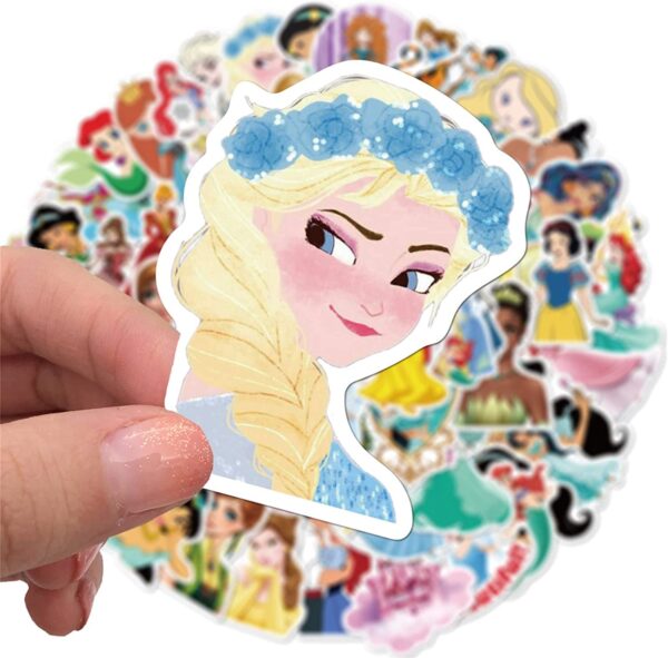 A Disney lover is holding a bunch of Disney princess stickers from the Disney Lover Mystery Sticker Pack.