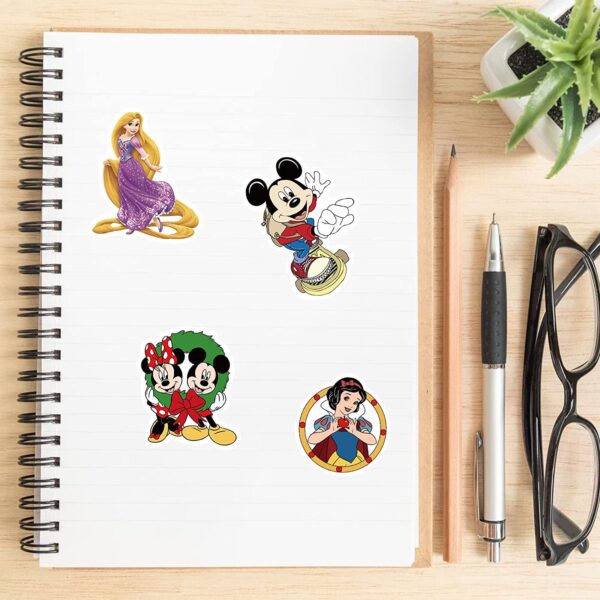 A Disney Lover Mystery Sticker Pack featuring Mickey Mouse and other beloved Disney characters on a notebook.