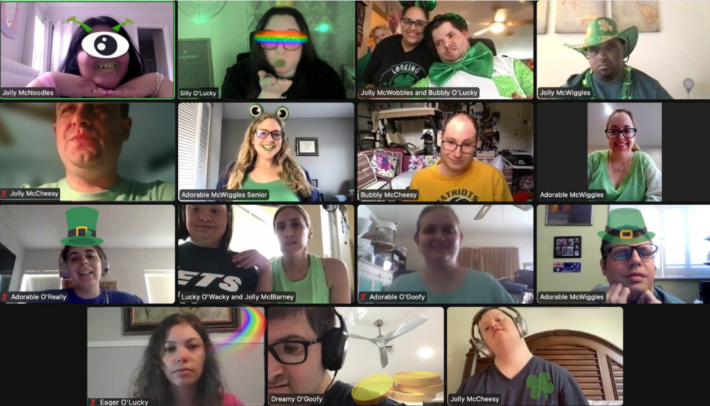 A group of people in green hats are on a video call.